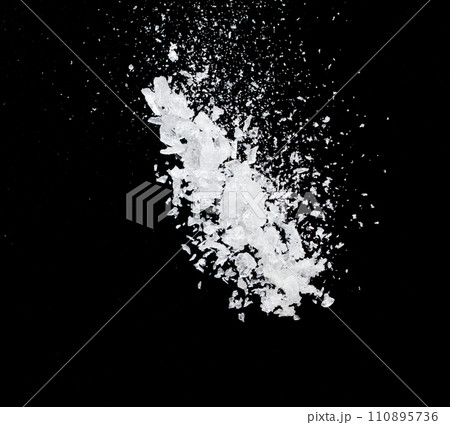 Ice Cubes explosion flying, crystal clear ice wave floating, fall down in air. Ice Brick crack cube is frozen water healthy thirsty. Black background Isolated high speed shutter, freeze stop motion 110895736