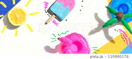 Summer concept with a flamingo float, lemon sunlight and a popsicle 110900178