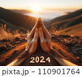 Yoga Mudra at Sunrise on Mountain with 2024 Inscription 110901764