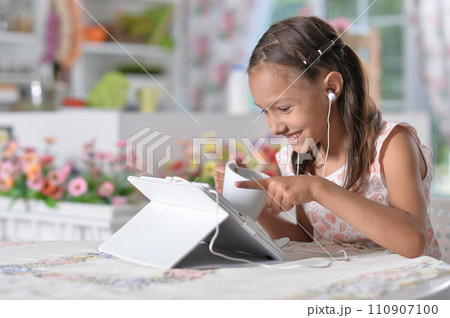 Portrait of young girl using modern laptop 110907100
