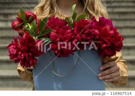 Flowers in paper, gift bags, on the street. 110907514