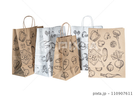 Recyclable craft paper bag for purchases, gifts and takeaway food mock up on white background. Environmentally friendly than single-use plastic bags Recyclable craft paper bag for purchases, gifts and takeaway food mock up on white background. Environmentally friendly than single-use plastic bags 110907611