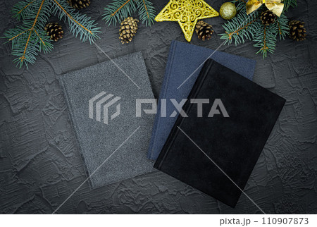 Cristmas gift. Notebook as a Christmas present. Close up of a blank velour fluffy notebook on black background with clipping path Cristmas gift. Notebook as a Christmas present. Close up of a blank velour fluffy notebook on black background with clipping path 110907873