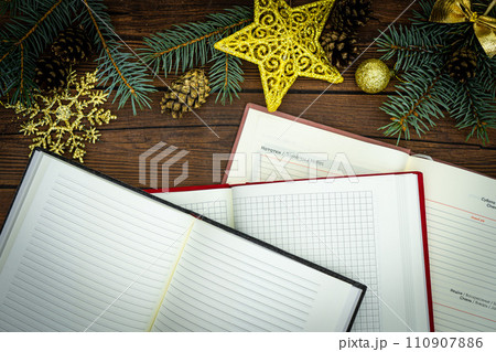 Cristmas gift. Notebook as a Christmas present. Close up of a blank velour fluffy notebook on black background with clipping path Cristmas gift. Notebook as a Christmas present. Close up of a blank velour fluffy notebook on black background with clipping path 110907886