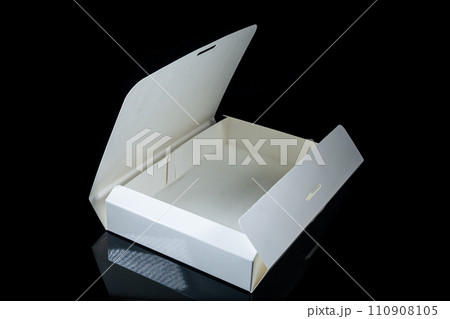 Blank package mockup. White paper box on black plaster background. Top view. Blank package mockup. White paper box on black plaster background. Top view. 110908105