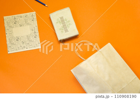 Top view brown paper shopping bag on colourful background, Mock-up of blank brown paper shopping bag and copy space. Flat lay. 110908190