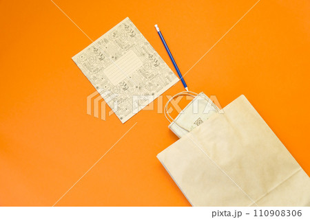 Top view brown paper shopping bag on colourful background, Mock-up of blank brown paper shopping bag and copy space. Flat lay. 110908306