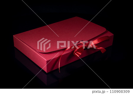 Man gift concept. gift box with luxury bow on dark background. Horizontal with copy space. Man gift concept. gift box with luxury bow on dark background. Horizontal with copy space. 110908309