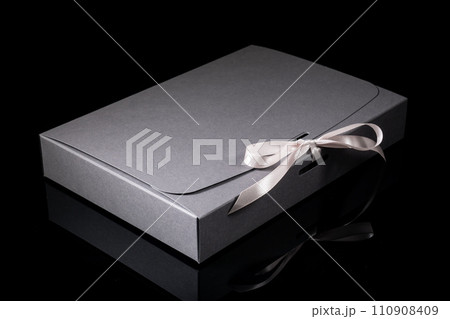 Man gift concept. gift box with luxury bow on dark background. Horizontal with copy space. 110908409