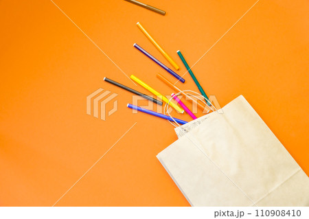 Top view brown paper shopping bag on colourful background, Mock-up of blank brown paper shopping bag and copy space. Flat lay. 110908410