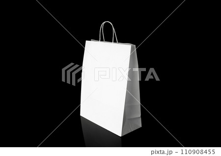 Recyclable craft paper bag for purchases, gifts and takeaway food mock up on black background. Environmentally friendly than single-use plastic bags Recyclable craft paper bag for purchases, gifts and takeaway food mock up on black background. Environmentally friendly than single-use plastic bags 110908455