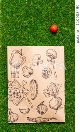 a paper bag lies on the green grass with fruits and vegetables around, moss, mock up a paper bag lies on the green grass with fruits and vegetables around, moss, mock up 110908490