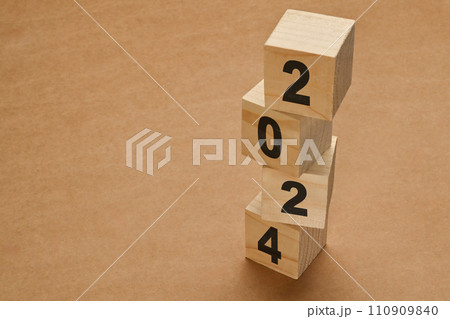 2024 numbers on wooden cube blocks stack on brown background. New Year 2024 Concept 2024 numbers on wooden cube blocks stack on brown background. New Year 2024 Concept 110909840