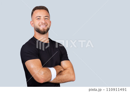 Happy confident strong millennial caucasian man coach in black sportswear, with crossed arms on chest Happy confident strong millennial caucasian man coach in black sportswear, with crossed arms on chest 110911491