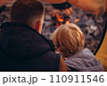 Man and boy tourists autumn time leisure, vacation hiking or traveling touristic activity. Family camping, father and little son relax in forest camp. 110911546
