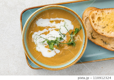 Portion of gourmet restaurant yellow pea soup Portion of gourmet restaurant yellow pea soup 110912324