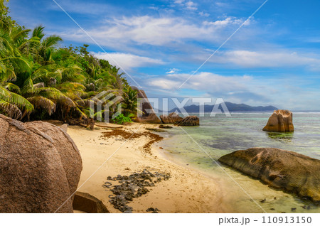 Anse Source D'argent beach with palm trees at La Digue Island, Seychelles Anse Source D'argent beach with palm trees at La Digue Island, Seychelles 110913150