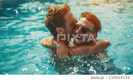 Gay couple relaxing in swimming pool. Gay couple relaxing in swimming pool. 110914138