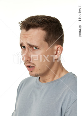 offended frustrated young man on white background. sadness offended frustrated young man on white background. sadness 110916911