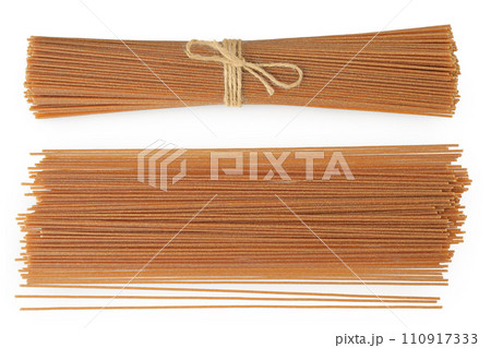 raw wholegrain spaghetti isolated on a white background. Top view. Flat lay 110917333