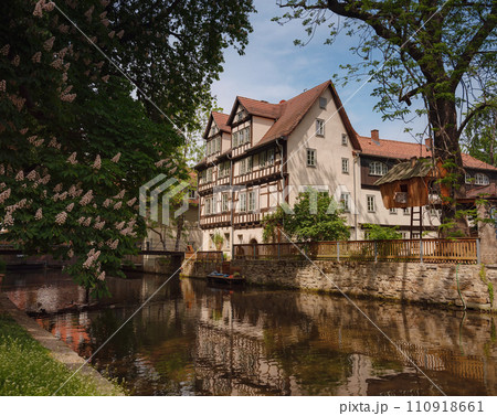 spring trip to Europe. Travel and German sightseeing locations. scenic view to facade of old historic houses somewhere in Erfurt city, Traditional half-timbered houses makes cozy and fairy tail mood spring trip to Europe. Travel and German sightseeing locations. scenic view to facade of old historic houses somewhere in Erfurt city, Traditional half-timbered houses makes cozy and fairy tail mood 110918661