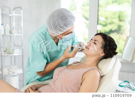 Facial injection female patient 110919709
