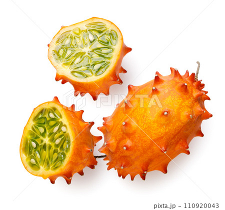 Kiwano and two halves on a white background. Top view Kiwano and two halves on a white background. Top view 110920043