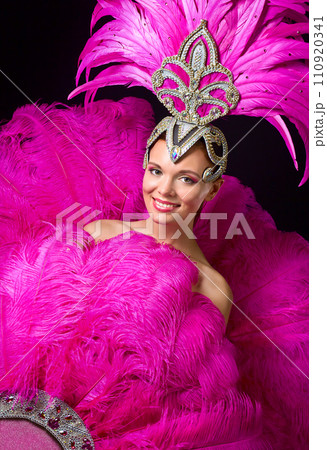 Beautiful Girl in carnival costume with pink feathers. 110920341