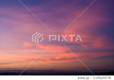 Evening time of panorama mountain under dramatic twilight sky and cloud. Nightfall Silhouette mountain on sunset. Evening time of panorama mountain under dramatic twilight sky and cloud. Nightfall Silhouette mountain on sunset. 110920576