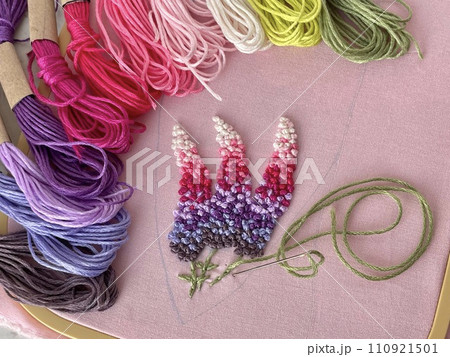embroidery of flowers in French knot technic, canvas, threads mouline and needle embroidery of flowers in French knot technic, canvas, threads mouline and needle 110921501