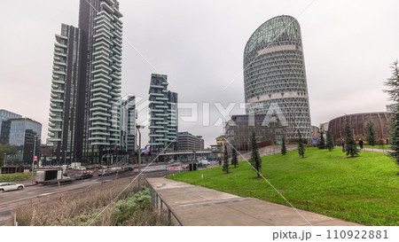 Panorama showing skyscrapers and biblioteca from park with green lawn timelapse in Milan 110922881