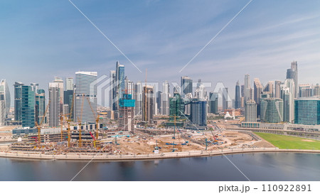 Cityscape with skyscrapers of Dubai Business Bay and water canal aerial timelapse. 110922891