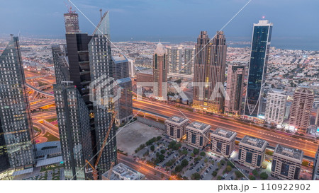 High-rise buildings on Sheikh Zayed Road in Dubai aerial night to day timelapse, UAE. 110922902