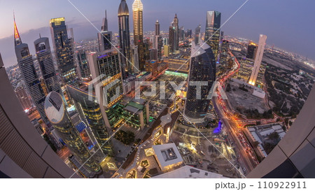 Skyline panorama of the high-rise buildings on Sheikh Zayed Road in Dubai aerial day to night timelapse, UAE. Skyline panorama of the high-rise buildings on Sheikh Zayed Road in Dubai aerial day to night timelapse, UAE. 110922911