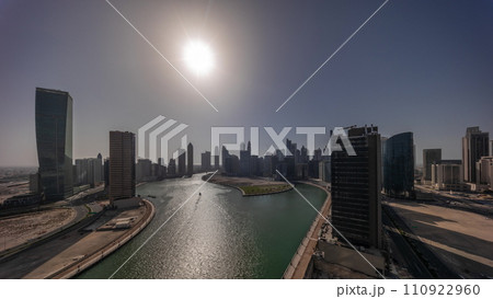 Cityscape skyscrapers of Dubai Business Bay with water canal aerial all day timelapse. Cityscape skyscrapers of Dubai Business Bay with water canal aerial all day timelapse. 110922960
