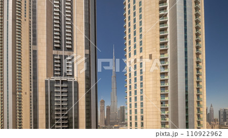 Tallest skyscrapers in downtown Dubai located on boulevard street near shopping mall aerial night to day timelapse. Tallest skyscrapers in downtown Dubai located on boulevard street near shopping mall aerial night to day timelapse. 110922962