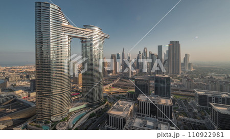 Futuristic Dubai Downtown and financial district skyline aerial night to day timelapse. 110922981