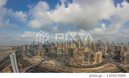 Panoramic skyline of Dubai with business bay and downtown district night to day timelapse. 110923004