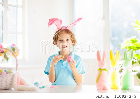 Kids on Easter egg hunt. Children dye eggs. Kids on Easter egg hunt. Children dye eggs. 110924245