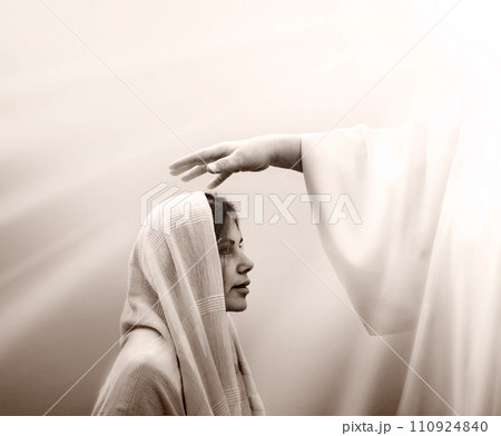 Blessing hand above the head of a woman in a headscarf 110924840