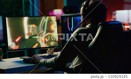 Player reaching final mission in coop FPS videogame, battling flying robots with his online friends. Gamer playing first person shooter game, fighting final boss helped by internet teammates Player reaching final mission in coop FPS videogame, battling flying robots with his online friends. Gamer playing first person shooter game, fighting final boss helped by internet teammates 110929185