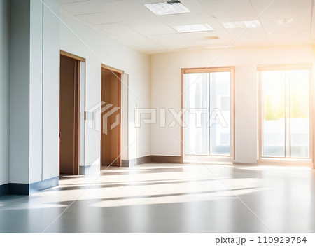 Light blurred background. The hall of an office or medical institution with panoramic windows and a perspective. 110929784