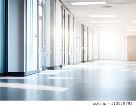 Light blurred background. The hall of an office or medical institution with panoramic windows and a perspective. Light blurred background. The hall of an office or medical institution with panoramic windows and a perspective. 110929792