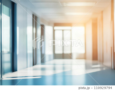 Light blurred background. The hall of an office or medical institution with panoramic windows and a perspective. Light blurred background. The hall of an office or medical institution with panoramic windows and a perspective. 110929794