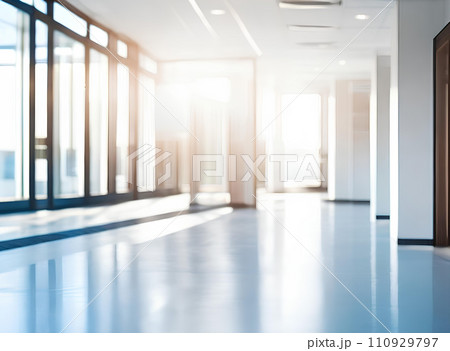 Light blurred background. The hall of an office or medical institution with panoramic windows and a perspective. Light blurred background. The hall of an office or medical institution with panoramic windows and a perspective. 110929797