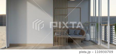 Interior design of a modern, minimalist living room with a white mockup wall and a balcony. Interior design of a modern, minimalist living room with a white mockup wall and a balcony. 110930709