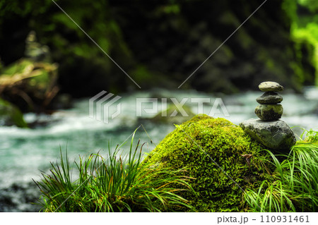 Stone stacking by a river in the forest Zen Japan 110931461