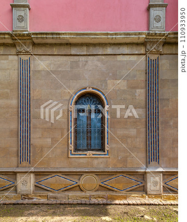 mamluk style arched Window with Wrought Iron Grilles in a brick wall 110933950