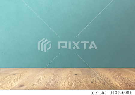 木目のあるナチュラルな木のテーブルと青の凹凸のある壁の背景 110936081