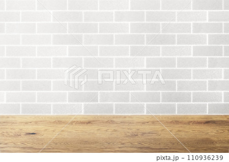 木目のあるナチュラルな木のテーブルとタイル長の壁の背景 木目のあるナチュラルな木のテーブルとタイル長の壁の背景 110936239